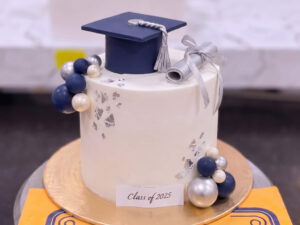 White Graduation Cap Cake with Blue Spheres in Lahore