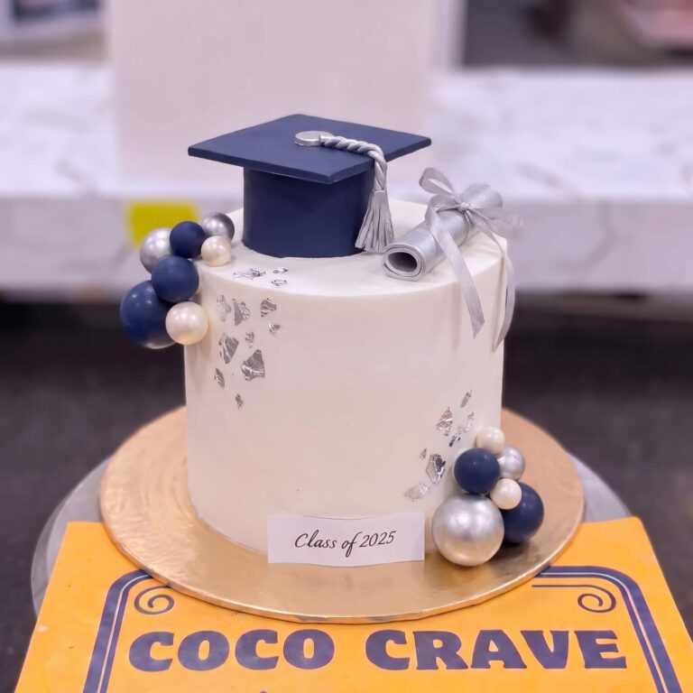 White Graduation Cap Cake with Blue Spheres in Lahore