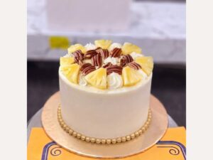 White Pineapple Pecan Cherry Cream Cake in Lahore