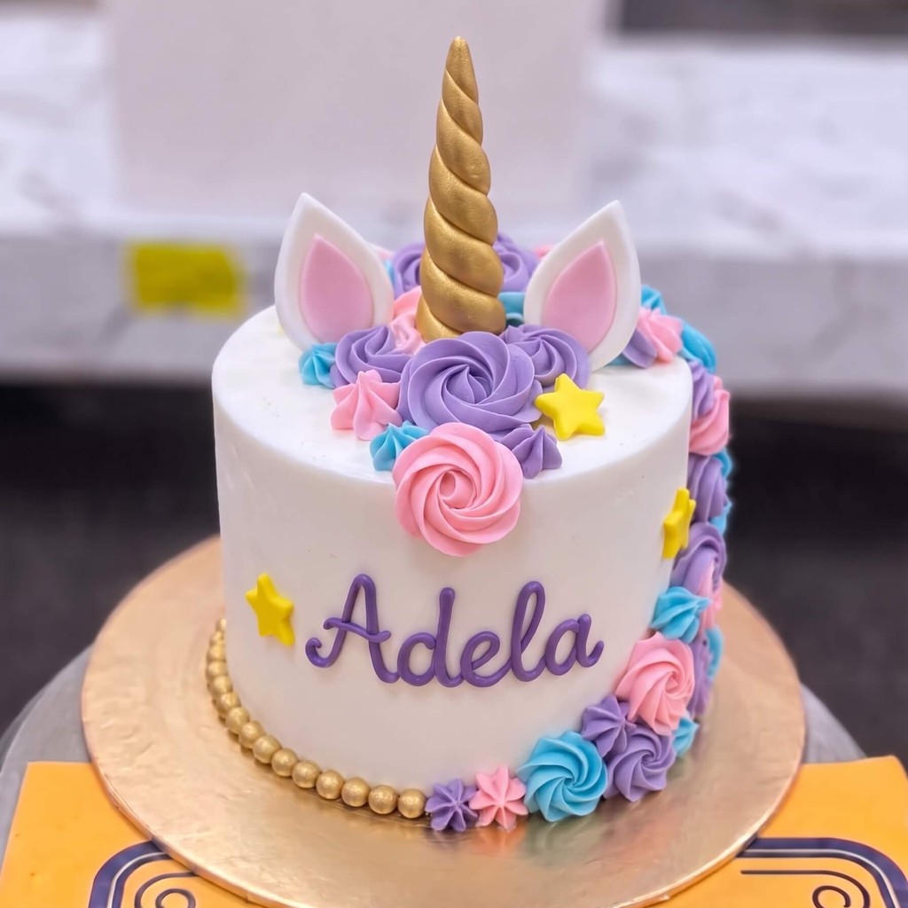 White Unicorn Cake with Purple Roses in Lahore — CocoCrave.pk White Unicorn Cake with Purple Roses in Lahore by CocoCrave.pk — single tier unicorn cake in White and Purple