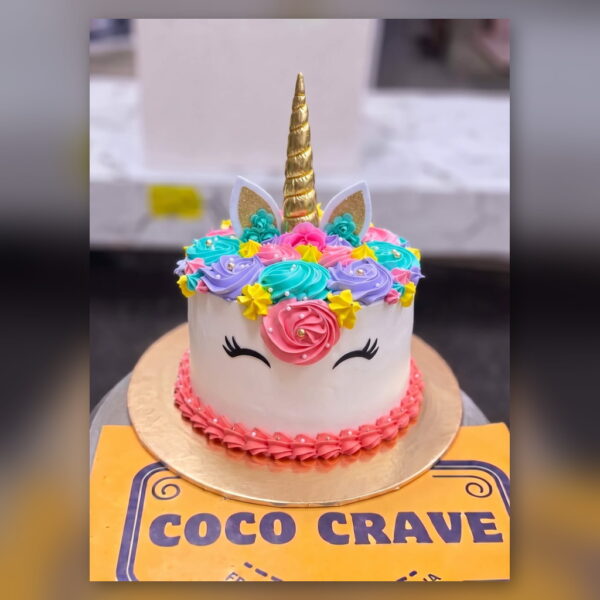 White Unicorn Cake with Rainbow Flowers in Lahore — delivered in Eme Society, Lahore