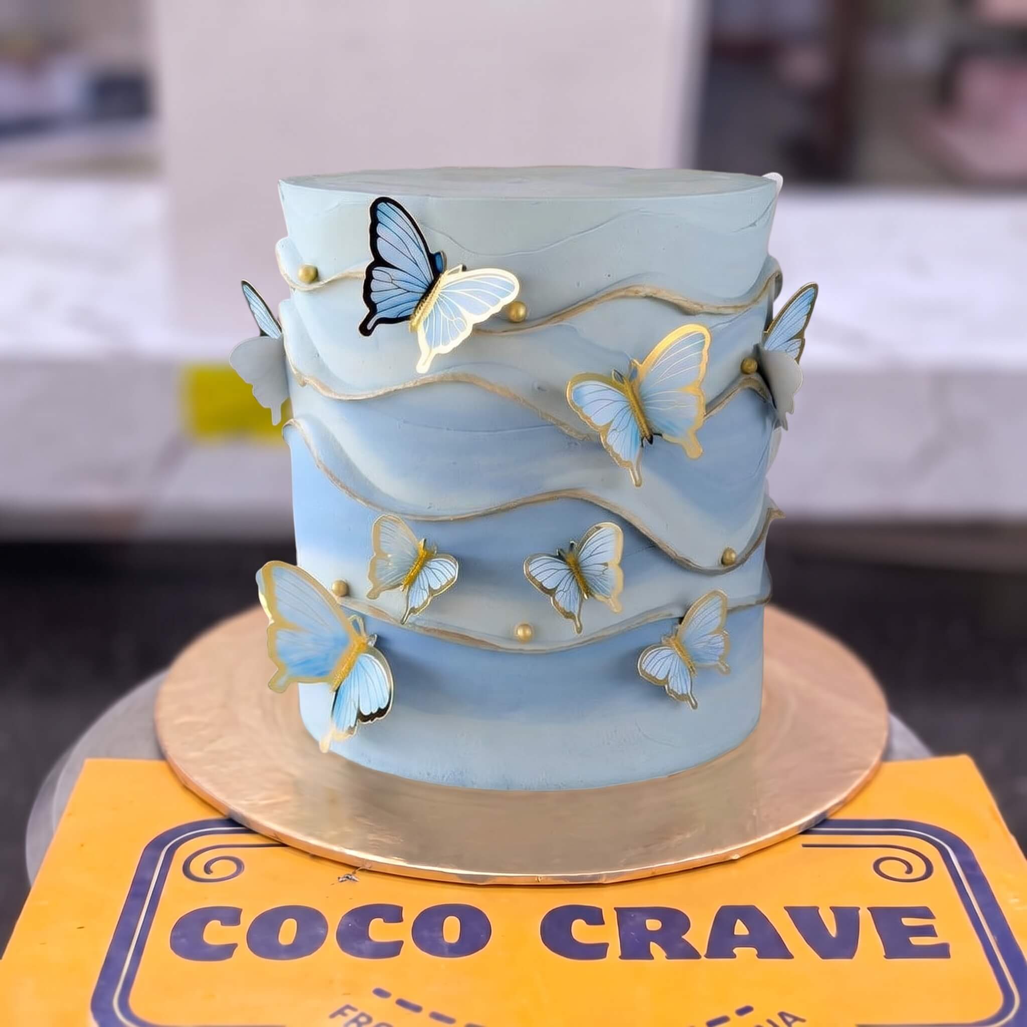 Blue Butterfly Gold Trim Cake in Lahore Blue Butterfly Gold Trim Cake in Lahore — CocoCrave Lahore