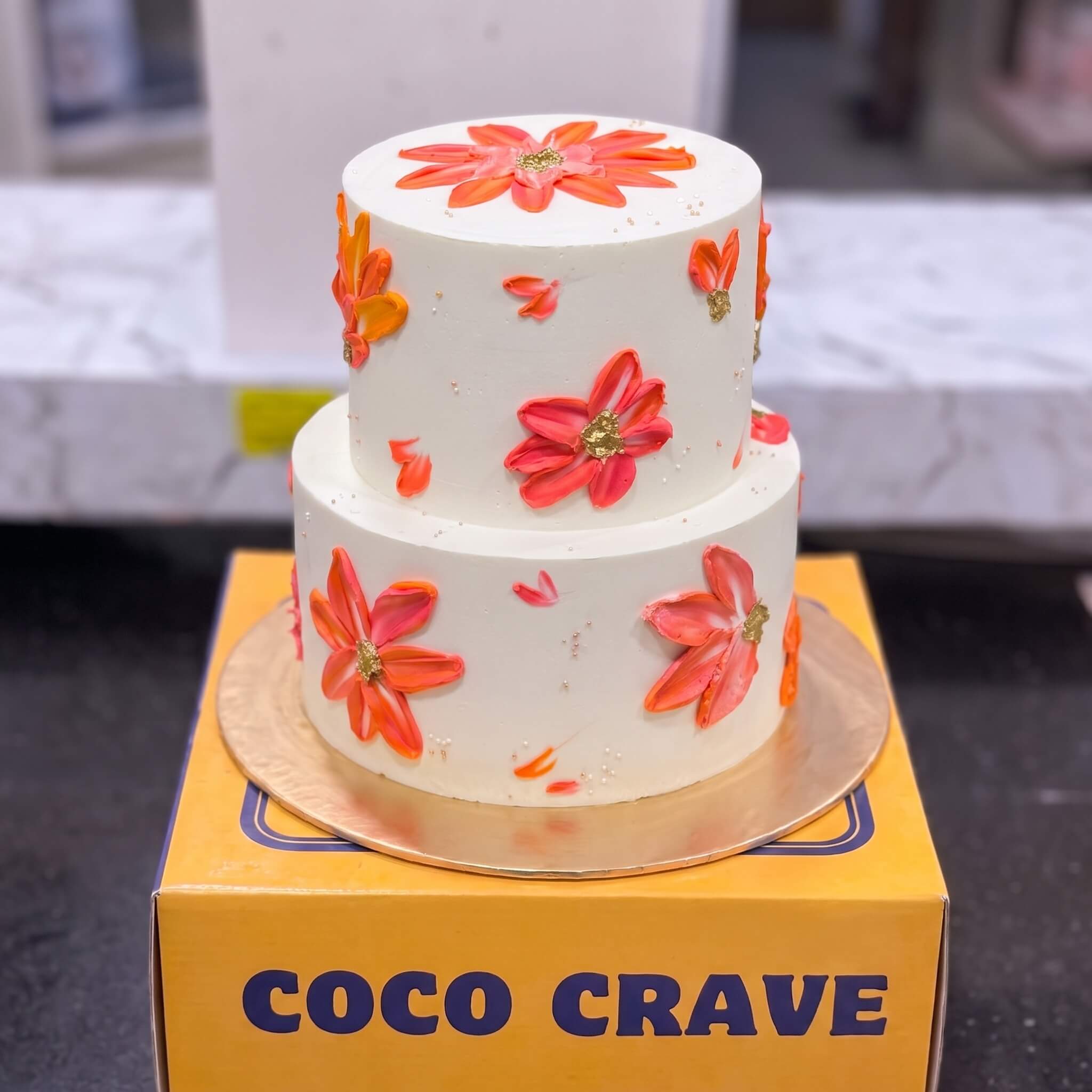 Orange Daisy Buttercream Two Tier Cake in Lahore Orange Daisy Buttercream Two Tier Cake in Lahore