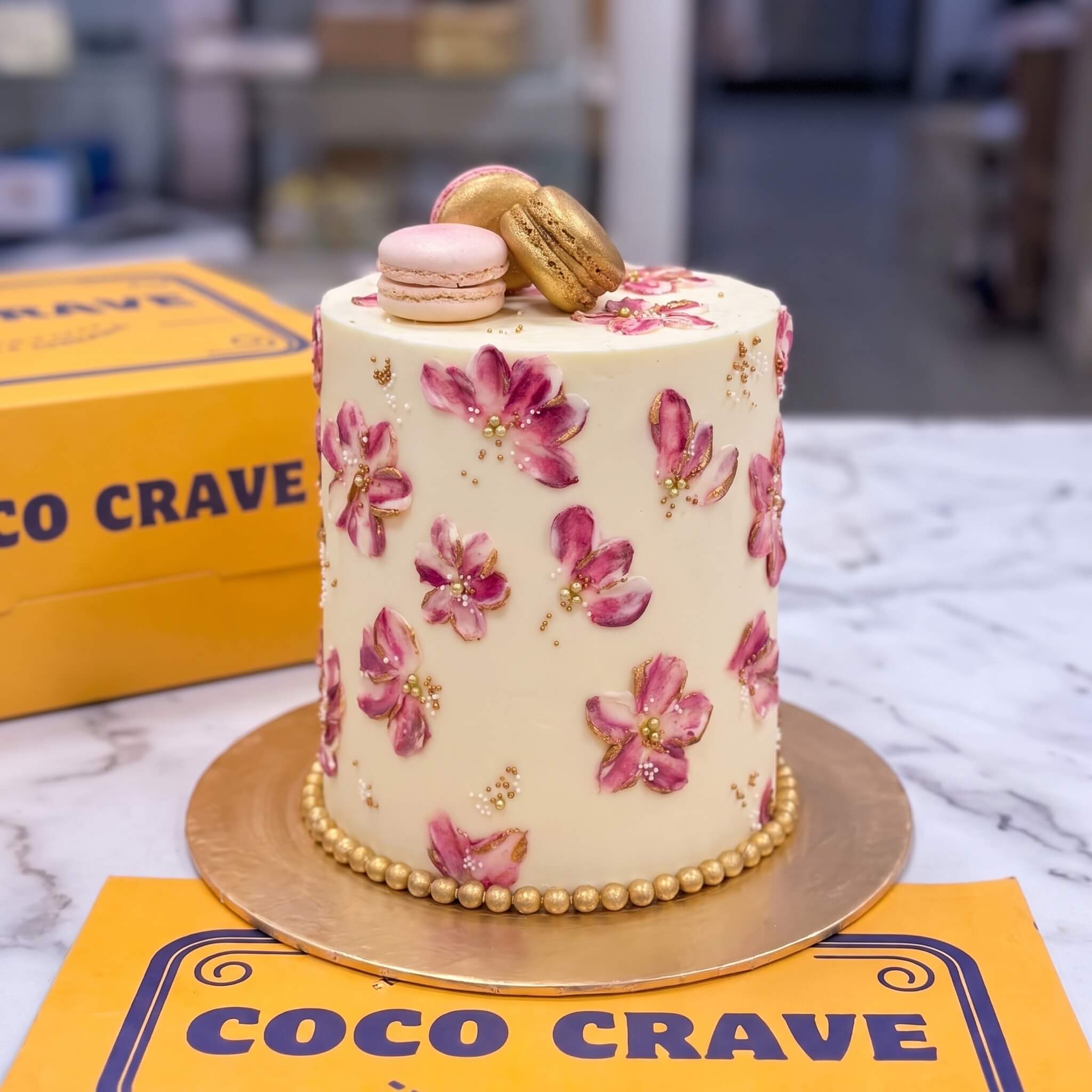 Painted Pink Floral Macaron Cake in Lahore Painted Pink Floral Macaron Cake in Lahore — CocoCrave Lahore