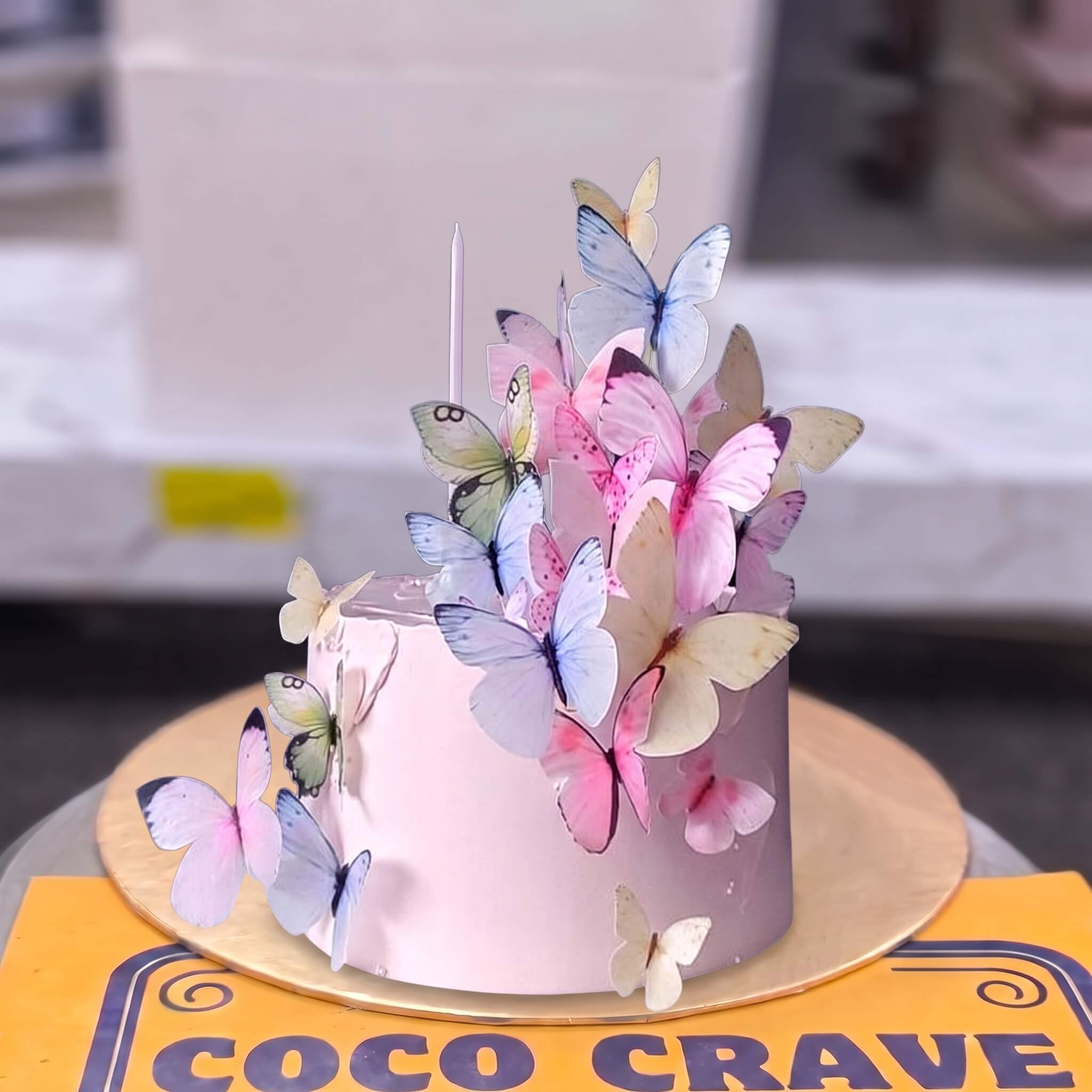 Pastel Pink Butterfly Cascade Cake in Lahore Pastel Pink Butterfly Cascade Cake in Lahore — CocoCrave Lahore